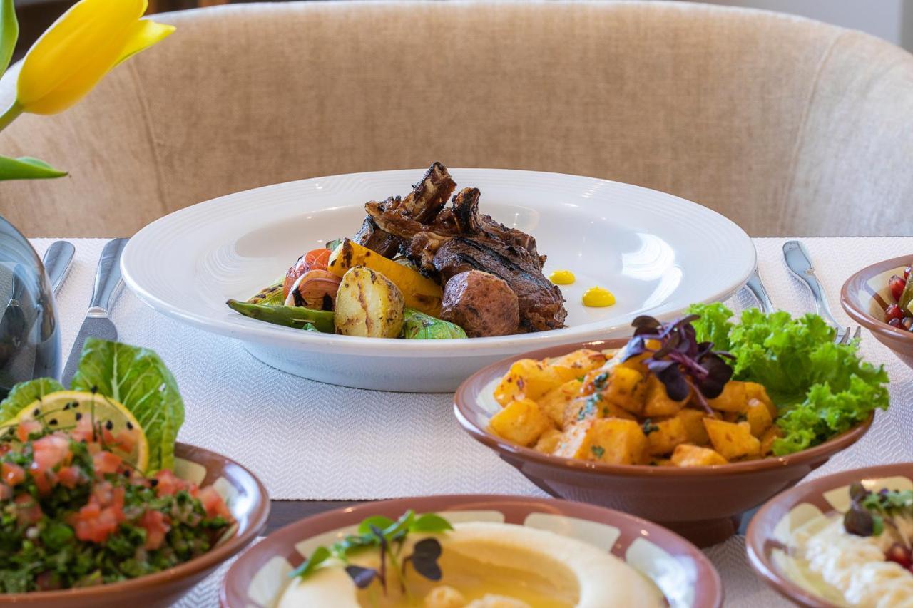 Voco Al Khobar By Ihg Hotel Екстериор снимка A selection of dishes at the restaurant